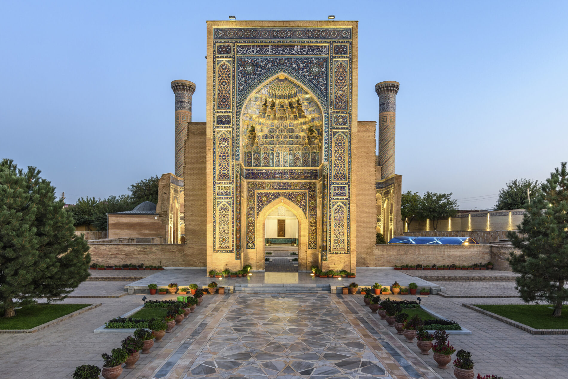 Exterior view of historic 15th century Madrasa building and courtyard at dusk.,Samarkand