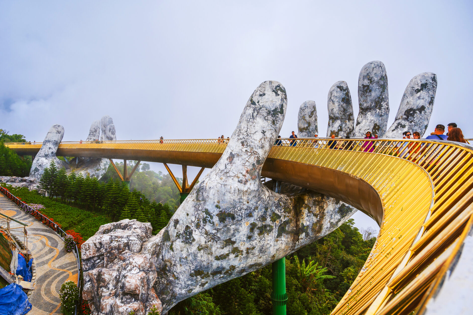 Golden Bridge Hands of God at Sun World Ba Na Hills Amusement Park in Da Nang in cloudy weather. Da Nang, Vietnam September 13, 2024